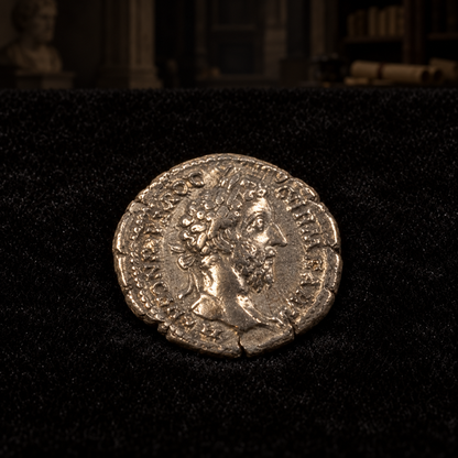 Representative coin obverse resting on black velvet with an illustrative historical background — Marcus Aurelius Silver Denarius — NGC Certified, AD 161–180