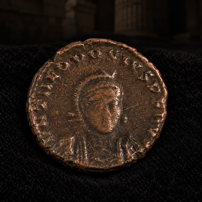Styled coin preview on black velvet with an illustrative historical background — Theodosius II Roman Bronze AE3 — NGC
